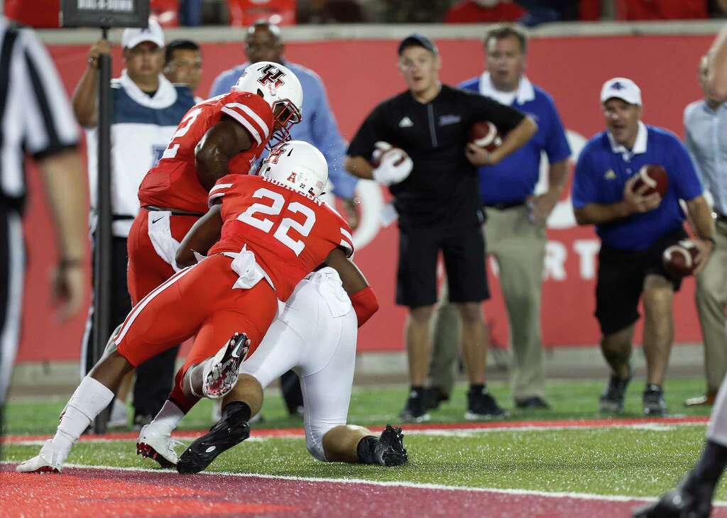 Houston Cougars safety Austin Robinson (22) stops Tulsa Golden Hurricane defensive tackle Jesse Brubaker (8) at the goal line in the final seconds of a tied game during the second half of an NCAA college football game at TDECU Stadium, Saturday, Oct. 15, 2016. Photo: Karen Warren, Houston Chronicle / 2016 Houston Chronicle