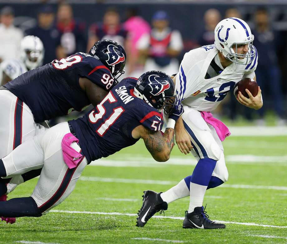 Indianapolis Colts quarterback Andrew Luck (12) is sacked by Houston Texans outside linebacker John Simon (51) and nose tackle D.J. Reader (98) during the first quarter of an NFL football game at NRG Stadium on Sunday, Oct. 16, 2016, in Houston. Photo: Brett Coomer, Houston Chronicle / © 2016 Houston Chronicle