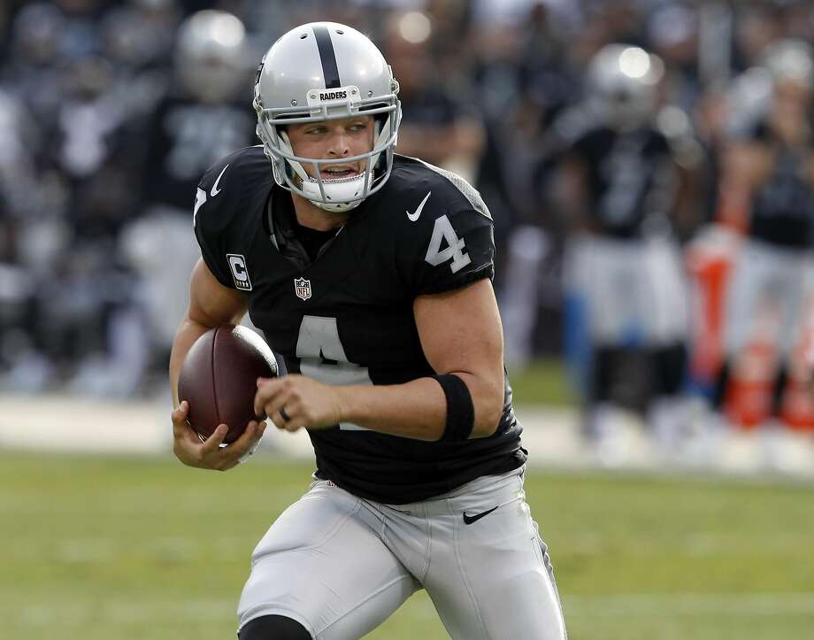 Derek Carr runs away from defensive pressure in the first half of Sunday’s game. The Raiders beat Buffalo 38-24 and are now 10-2. Photo: Brant Ward