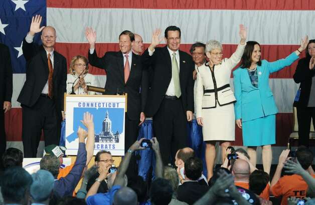  gather on the stage at the conclusion of the 2010 State Democratic ...