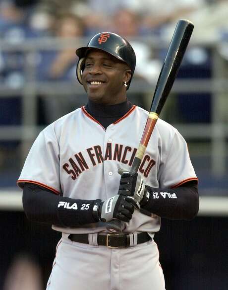 San Francisco Giants' Barry Bonds sports a big grin as he is intentionally walked in the first inning of the Giants game against the San Diego Padres in San Diego, in this June 3, 2002 photo. Photo: DENIS POROY, AP
