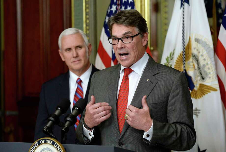 Accompanied by Vice President Mike Pence, Rick Perry speaks after being sworn in as secretary of energy. On Friday, he addressed the department's employees.Keep going for a look back at Rick Perry's tenure in Texas through the eyes of Houston Chronicle editorial cartoonist Nick Anderson.  Photo: Olivier Douliery, MBR / Abaca Press