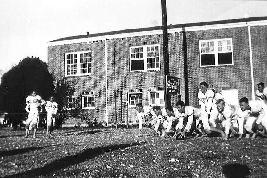 HereÂ’s a 1930 football practice of the Dayton Broncos on SH 90 in front of the old gymnasium. The Dayton Sports Hall of Fame is seeking photos from residents and former athletes for use in the museum. Photo: Submitted