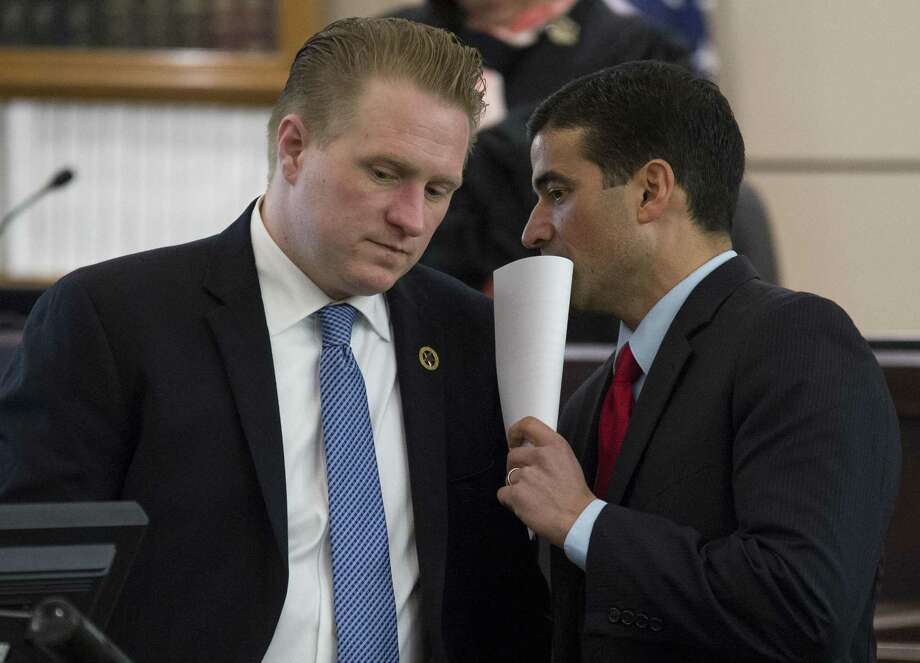 File Photo-Bexar County District Attorney and lead prosecutor Nico Lahood, right, confers with prosecutor Jason Goss during the trial of Miguel Martinez for the January 2015 murder of Laura Carter, Wednesday, Feb. 8, 2017, in the 437th District Court in San Antonio. (Darren Abate/For the San Antonio Express-News) Photo: Darren Abate, FRE / San Antonio Express-News