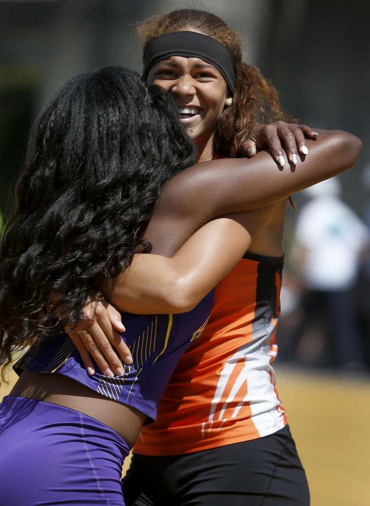Santa Rosa High School's Kirsten Carter hugs Chinyere Okoro (left) from Amador Valley High after Carter narrowly defeated Okoro and took first place in the girls 100 meter run at the North Coast Section Meet of Champions in Berkeley, Calif. on Saturday, May 27, 2017. Photo: Paul Chinn, The Chronicle