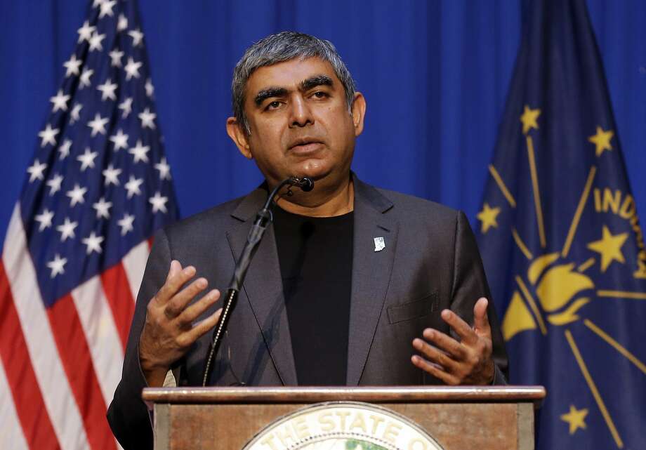 Vishal Sikka, CEO of Infosys, announces plans to increase his company’s operations in the U.S, establishing four new state-of-the-art technology and innovation hubs in the U.S., with the first one in Indiana. He made the announcement at the Statehouse in Indianapolis in May 2017. Sikka said in April that the company will expand its local hiring to “mitigate any potential risks from visa regulations in the U.S.” Photo: Michael Conroy, Associated Press