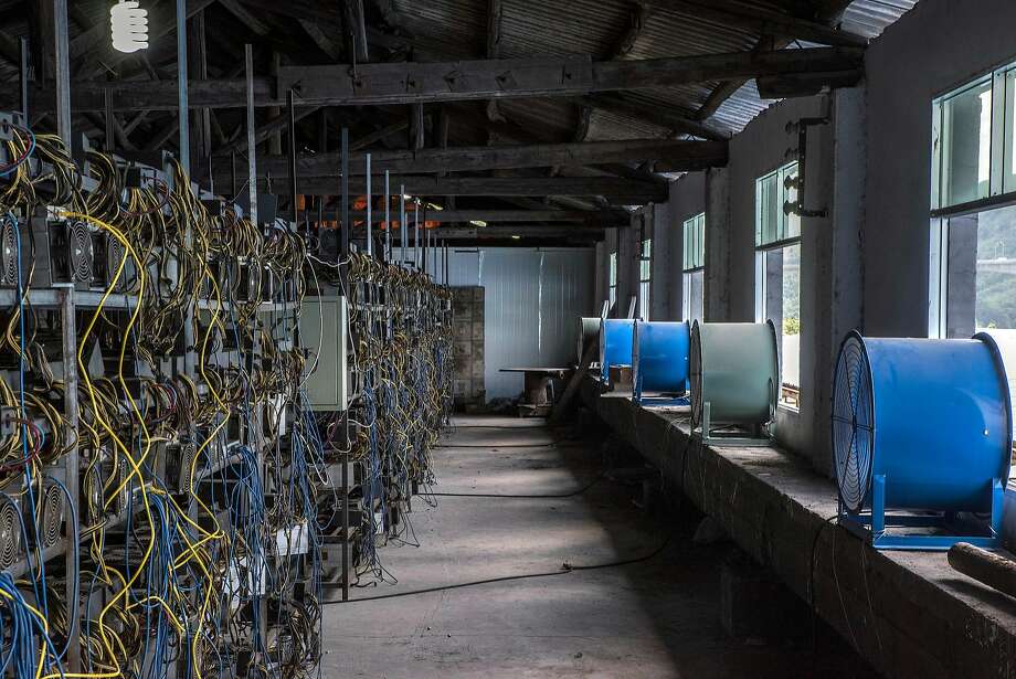 FILE  Fans cool racks of bitcoin-mining machines at a server farm in Guizhou, China, June 23, 2016. The value of Ether, the digital money that lives on an upstart network known as Ethereum, has risen an eye-popping 4,500 percent since the beginning of 2017, and may soon surpass bitcoin, its inspiration. (Gilles Sabrie/The New York Times) Photo: GILLES SABRIE, NYT