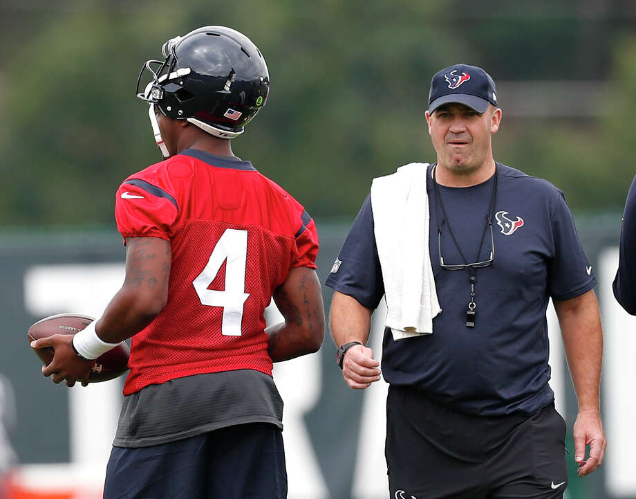 Houston Texans head coach Bill O'Brien walks past  quarterback Deshaun Watson (4)warms up during the opening practice of training camp at the Greenbrier on Wednesday, July 26, 2017, in White Sulphur Springs, W.Va. Photo: Brett Coomer, Houston Chronicle / u00a9 2017 Houston Chronicle}