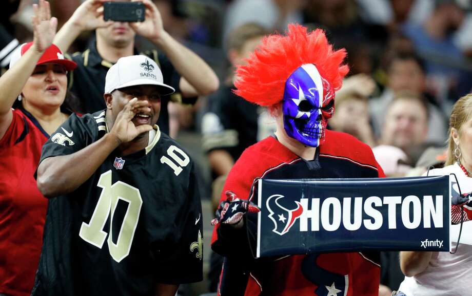 New Orleans Saints and Houston Texans fans cheer during the first quarter of an NFL pre-season football game at the Mercedes Benz Superdome on Saturday Aug. 26 2017 in New Orleans