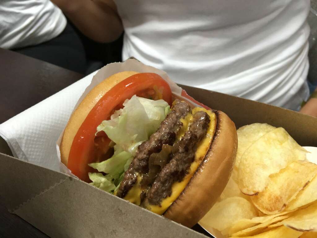 In-N-Out — Cheeseburger with onion, ketchup, and mustard, no spread [480 calories) 22 grams of protein27 grams of fat41 grams of carbs 1,080 milligrams of sodium Heath Tip: Skip the special sauce. Go for some ketchup and mustard to slash some fat and calories, and opt for a regular burger instead of a Double-Double.  Photo: Ming Yeung/Getty Images Europe