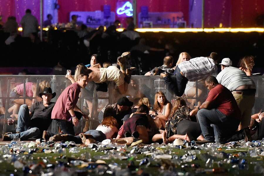 People scramble for shelter at the Route 91 Harvest country music festival after gun fire was heard on October 1st, 2017, in Las Vegas, Nevada.  Photograph: David Becker/Getty Images.