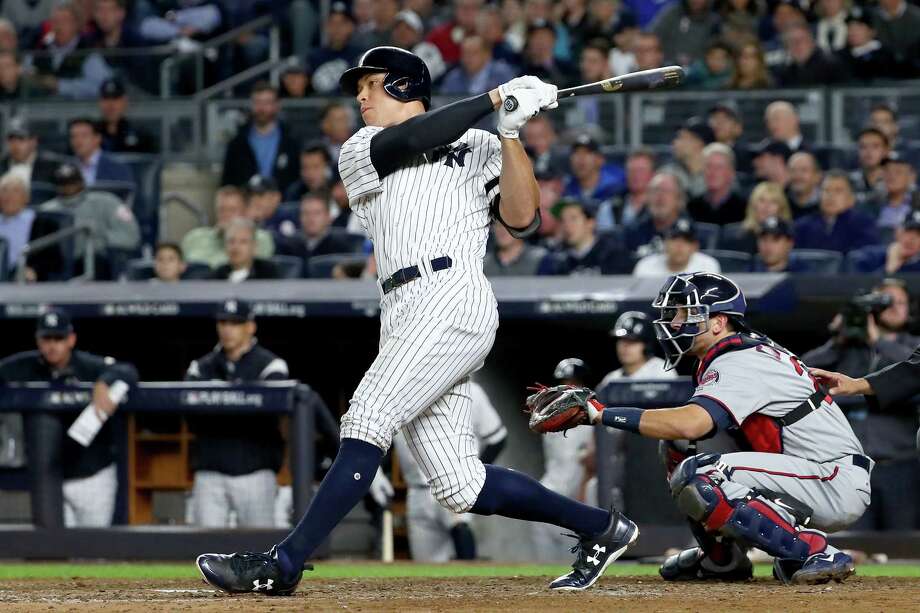 NEW YORK, NY - OCTOBER 03:  Aaron Judge #99 of the New York Yankees hits a two run home run against Jose Berrios #17 of the Minnesota Twins during the fourth inning in the American League Wild Card Game at Yankee Stadium on October 3, 2017 in the Bronx borough of New York City.  (Photo by Al Bello/Getty Images) ORG XMIT: 775053345 Photo: Al Bello / 2017 Getty Images