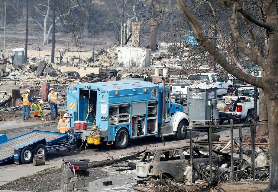 PG&E crews work Tuesday on Vintage Circle in the heart of Santa Rosa's Fountaingrove neighborhood, which suffered heavy damage in the Tubbs Fire. Photo: Paul Chinn, The Chronicle