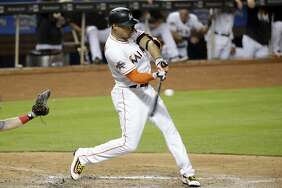 Marlins right fielder Giancarlo Stanton, seen batting during a July game against Cincinnati, hit 59 home runs last season in a career-high 159 games. The Giants as a team hit just 128.