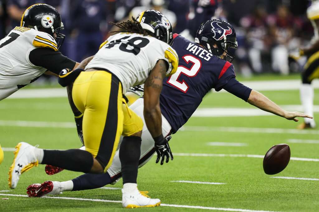 Houston Texans quarterback T.J. Yates (2) fumbles as he is sacked by Pittsburgh Steelers defensive end Cameron Heyward (97) and outside linebacker Bud Dupree (48) during the second quarter of an NFL football game at NRG Stadium on Monday, Dec. 25, 2017, in Houston. ( Brett Coomer / Houston Chronicle ) Photo: Brett Coomer/Houston Chronicle