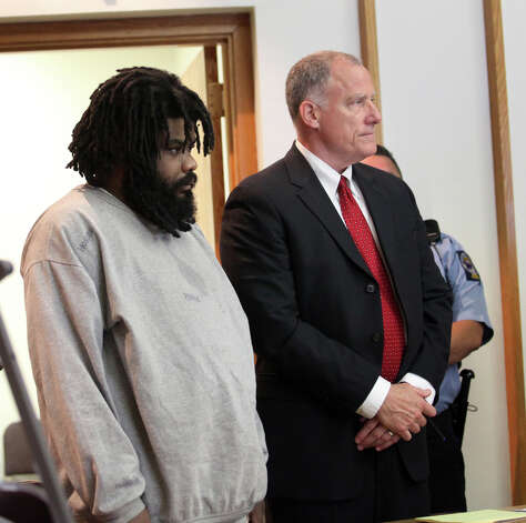 Tyree Smith, left,  stands with public defender Joseph Bruckmann on the first day of trial before a three judge panel in Bridgeport, Conn.  on Monday, July 1, 2013. Smith is charged with the murder of Angel "Tun Tun" Gonzalez. Photo: BK Angeletti, B.K. Angeletti / Connecticut Post freelance B.K. Angeletti
