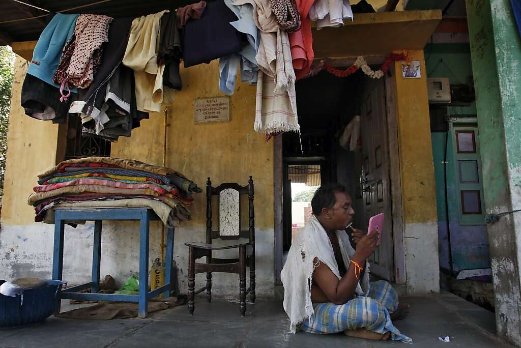 A relative of Raman Parmar shaves in Khambhat, India, Monday, June 3, 2013. Photo: Nicole Fruge, The Chronicle