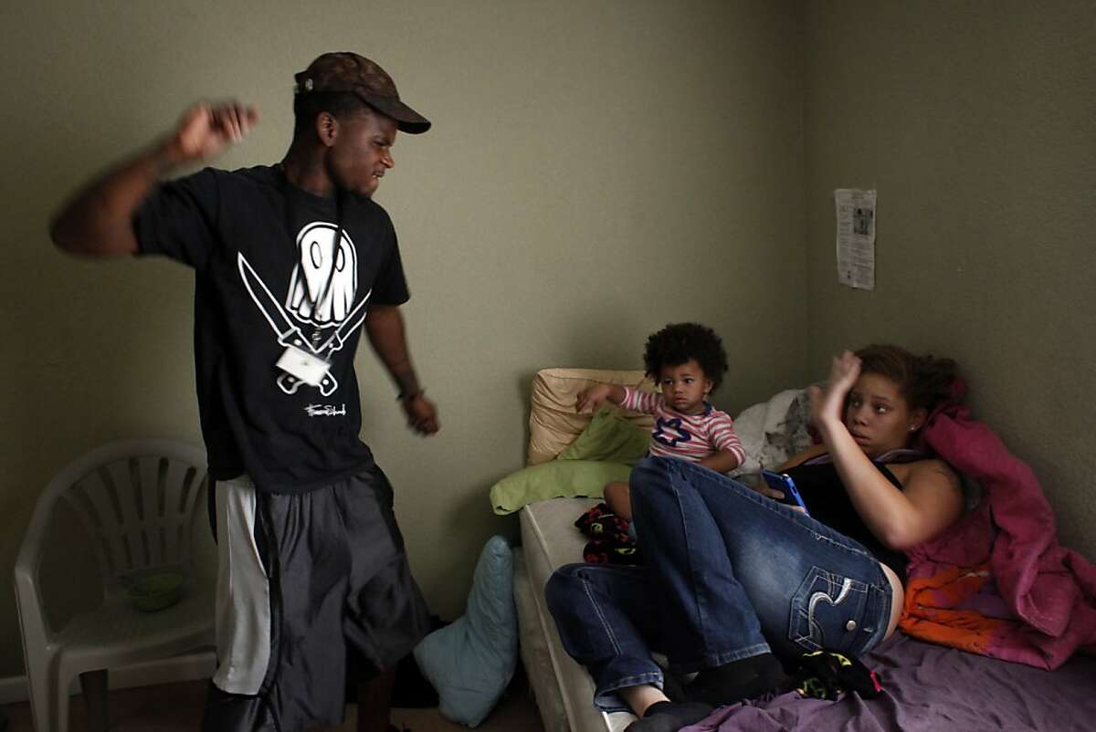 Quindell Anderson gets angry as he talks with his girlfriend Brijjanna Price while she cares for their daughter LaMya Deshana Price on Wednesday, November 6, 2013, in Hayward, Calif. Photo: Lacy Atkins, The Chronicle