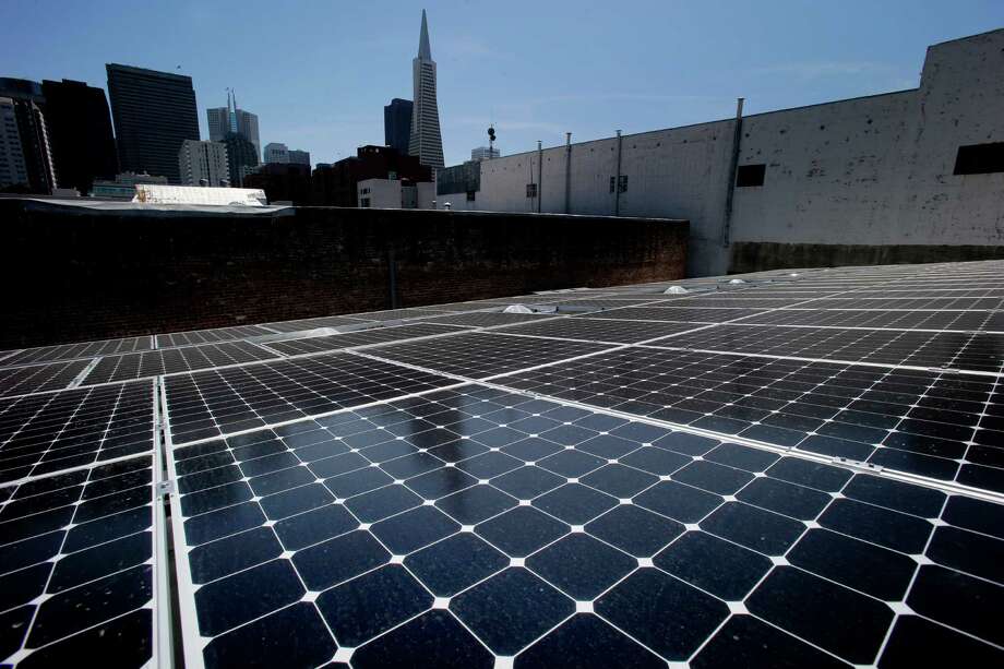 State-of-the-art solar panels pick up the afternoon sun on the rooftop of DPR Construction in San Francisco, which has moved into the first “zero net energy” office building in the city. The building was renovated to produce as much energy as it uses over the course of a year. Photo: Brant Ward / The Chronicle / ONLINE_YES