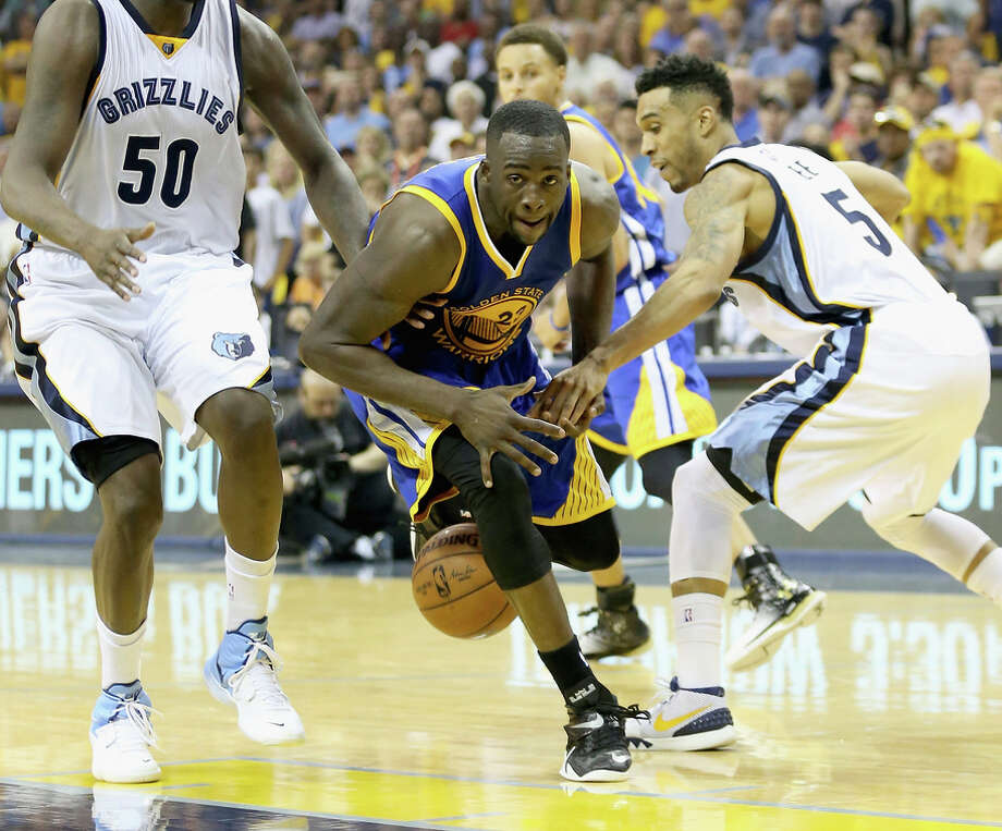 MEMPHIS, TN - MAY 09:  Draymond Green #23 of the Golden State Warriors has the ball knocked away by Courtney Lee #5 of the Memphis Grizzlies during Game three of the Western Conference Semifinals of the 2015 NBA Playoffs at FedExForum on May 9, 2015 in Memphis, Tennessee. NOTE TO USER: User expressly acknowledges and agrees that, by downloading and or using this photograph, User is consenting to the terms and conditions of the Getty Images License Agreement  (Photo by Andy Lyons/Getty Images) Photo: Andy Lyons / Getty Images / 2015 Getty Images