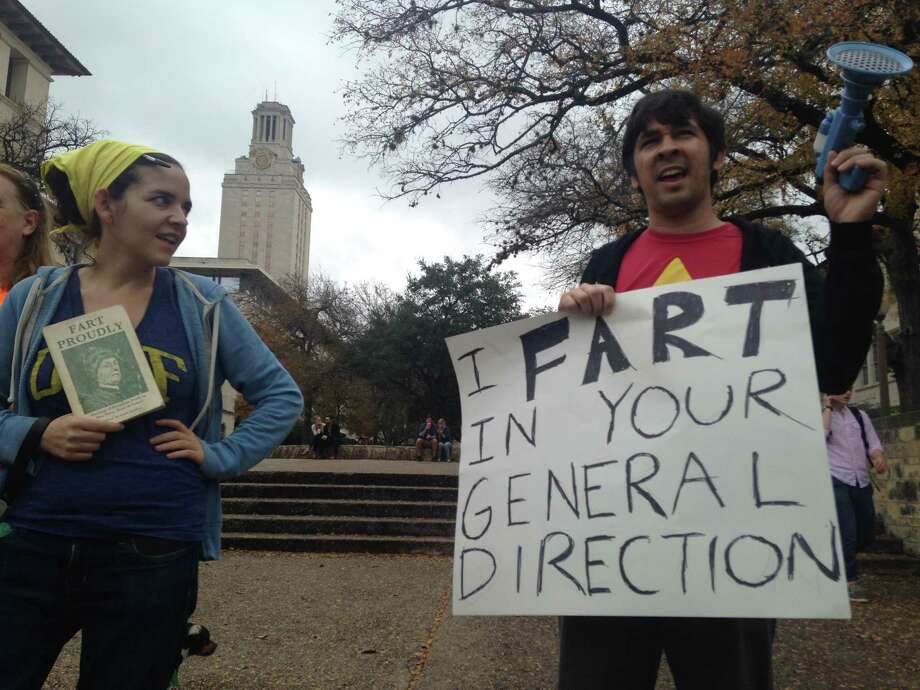 Protesters wielding dildos and machines playing fart machines came out in droves to challenge against a group of pro-gun activists staging a "mock mass shooting" near the University of Texas at Austin on Saturday, Dec. 12, 2015. Photo: Lauren McGaughy, The Houston Chronicle