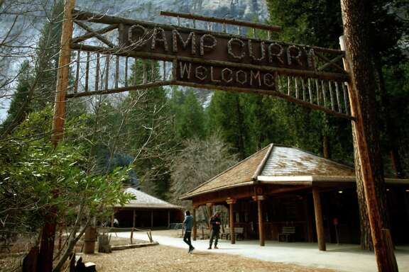 The historic wood sign at Camp Curry still greets visitors arriving at the famous lodging site in Yosemite March 26, 2013. Construction and mitigation measures are progressing at Camp Curry, a year after hantavirus sickened and killed several visitors staying in some of the signature tent cabins
