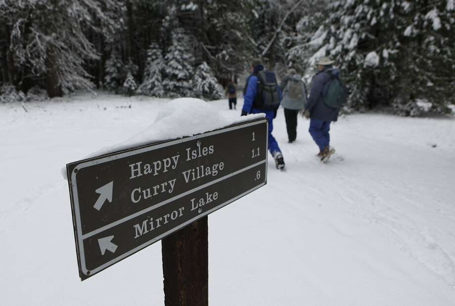 A sign directs Yosemsite visitors to Curry Village, which will become Half Dome Village if the name-rights dispute is not resolved. Photo: Michael Maloney, The Chronicle