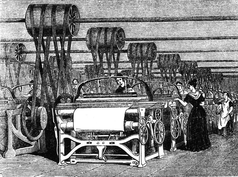 Power looms being used in textile manufacturing during the industrial revolution. Photo: Hulton Archive, Getty Images