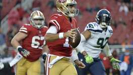 San Francisco 49ers quarterback Jimmy Garoppolo (10) runs against the Seattle Seahawks during the second half of an NFL football game Sunday, Nov. 26, 2017, in Santa Clara, Calif. (AP Photo/Don Feria)