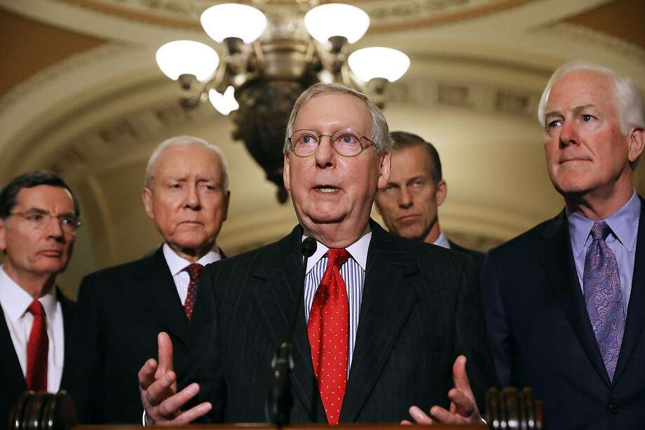 Majority Leader Mitch McConnell (center) is joined by fellow Republican senators as he speaks with reporters at the Capitol about plans to vote on tax-overhaul legislation this week. Photo: Chip Somodevilla, Getty Images